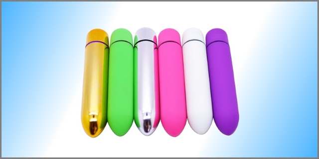 Six bullet vibrators of varying colors with blue-white gradient background