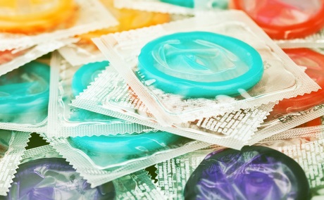 close-up of pile of condoms in various colors