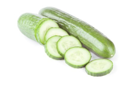 fresh cucumbers over white background