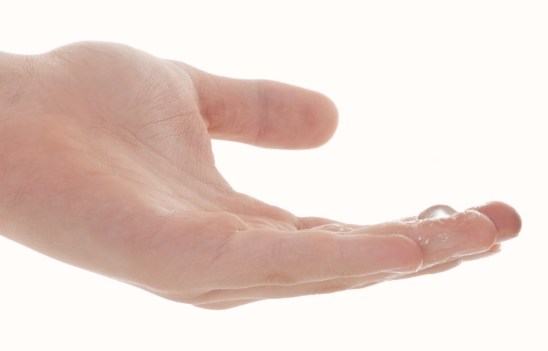 Close up of hand with some sex lube on the fingertips